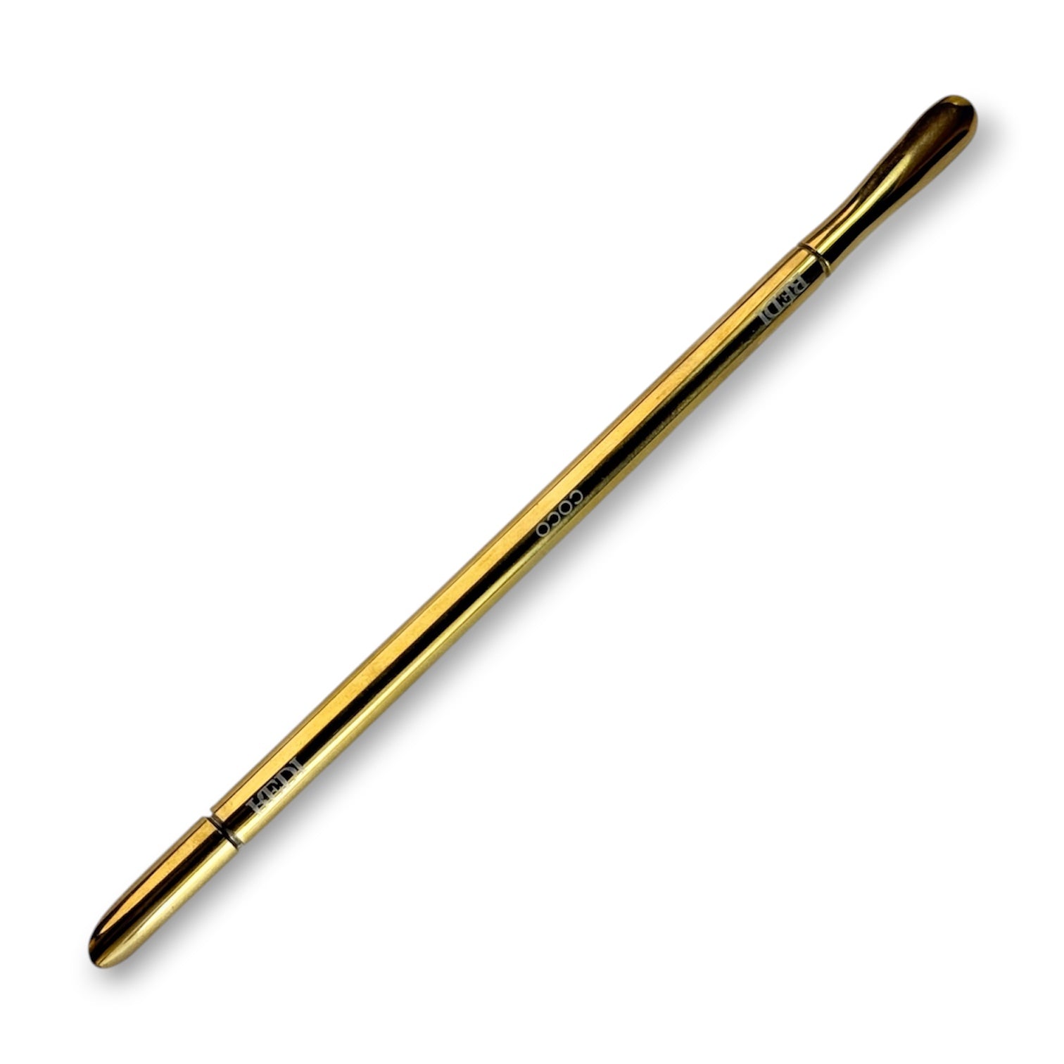Gold metal beauty applicator tool for precise makeup application.